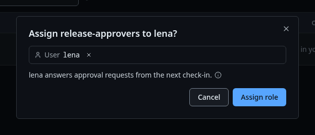 The Assign release-approvers dialog on the role's page, with lena picked
