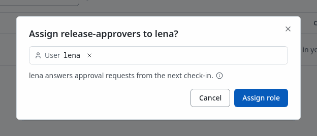 The Assign release-approvers dialog on the role's page, with lena picked